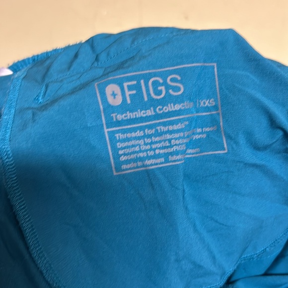 Figs I believe the color is pacific blue scrubs top and bottom are XXS. - Picture 3 of 7